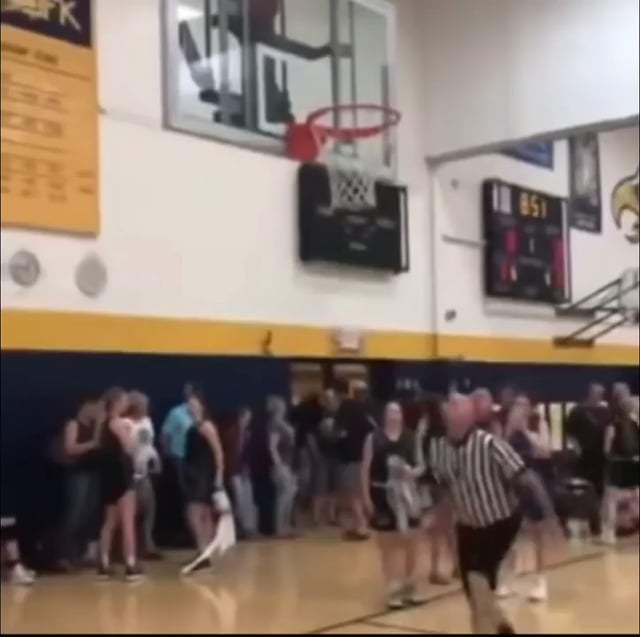 Referee gets the ball unstuck from the hoop with insane strength