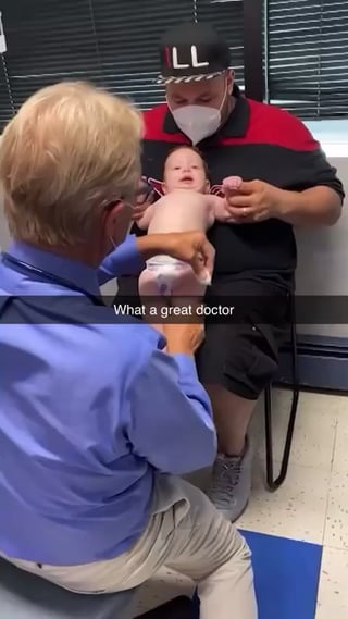 Doctor expertly keeps a baby entertained and calm while giving them a shot