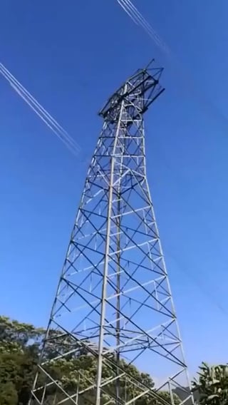 Controlled demolition of a transmission tower.