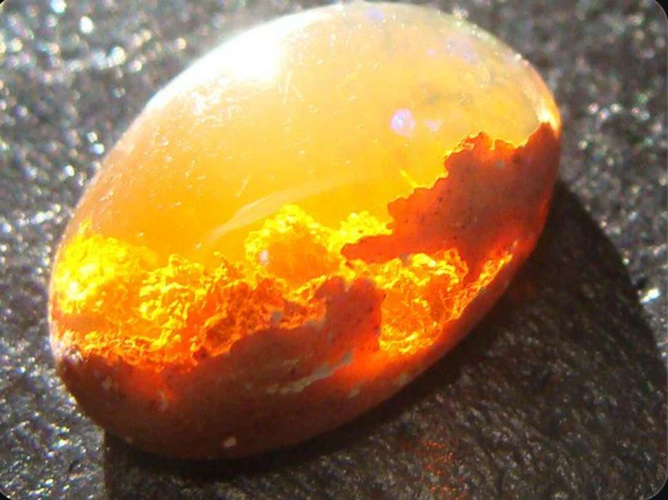 The striking Mexican Fire Opal looks like someone caught sunset in stone