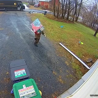 UPS delivery man goes the extra level to hide the package.