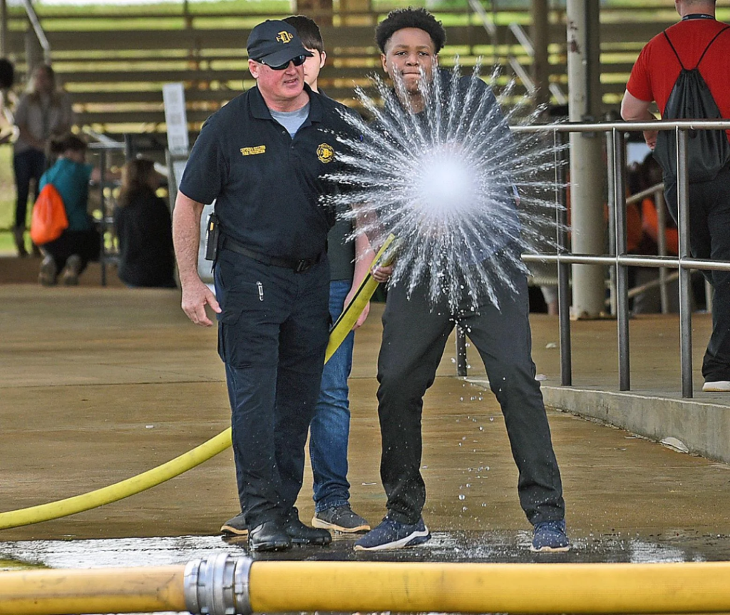 This student starting a firehose and a photo being taken at the exact moment. That water pattern is awesome