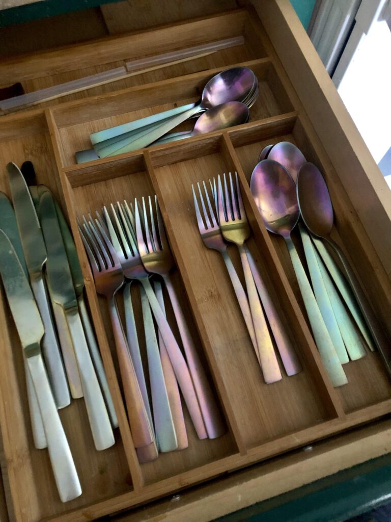 My cutlery used to be gold-coloured but has turned iridescent over time