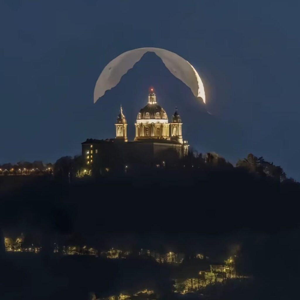 A photographer from Italy named Valerio Minato waited 6 years to get a perfect picture of the moon, mountain & the basilica