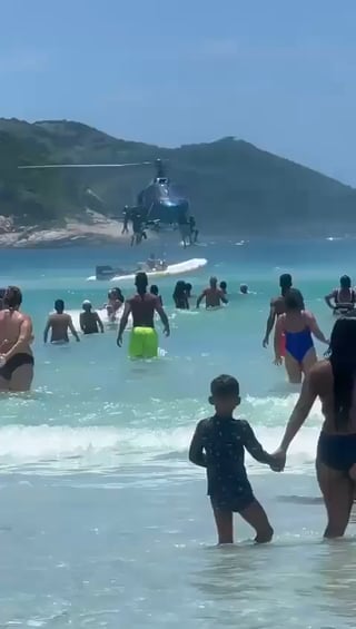 Brazilian police officer drops rifle into the sea during aerial patrol in Rio de Janeiro, and swimmer returns it