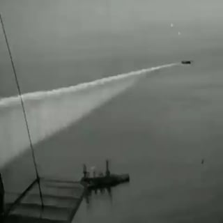 This is Pre-WWII footage of a smoke curtain, used to hide ships during a naval battle, being deployed