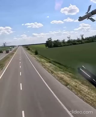 Cockpit footage from a pair of Ukrainian Mi-24 Hind gunships following a motorway to the front at extremely low altitude.