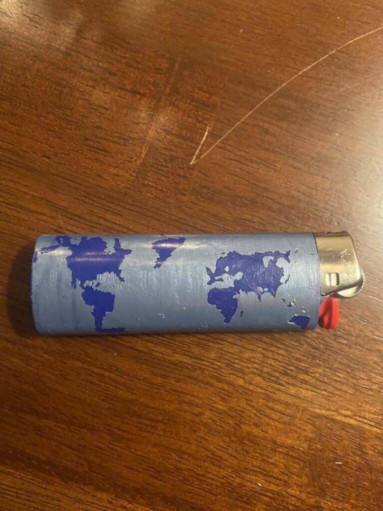 I put nail polish on my lighter and scratched the world into it