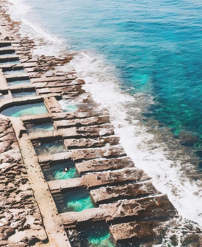 Roman baths’ remnants, carved into the rocky coastline. Sliema, Malta.