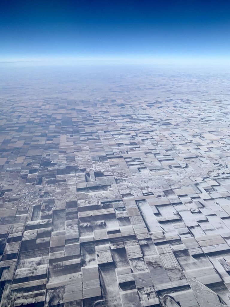 This is 100% flat farmland. Several years ago I snapped this pic out of the plane window in Eastern CO. The snow drifts and melt on the crops had crea…