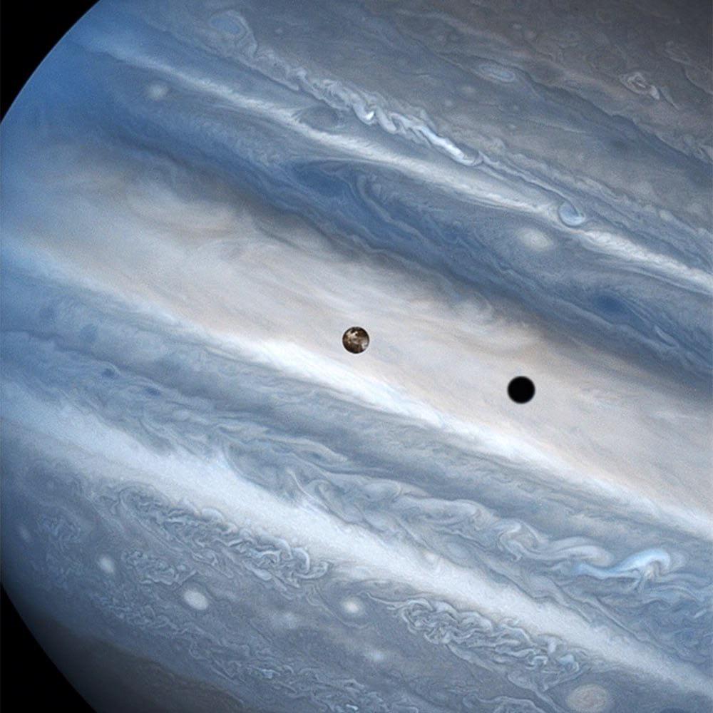 Jupiter, Io and its shadow in a frame from the Hubble Space Telescope