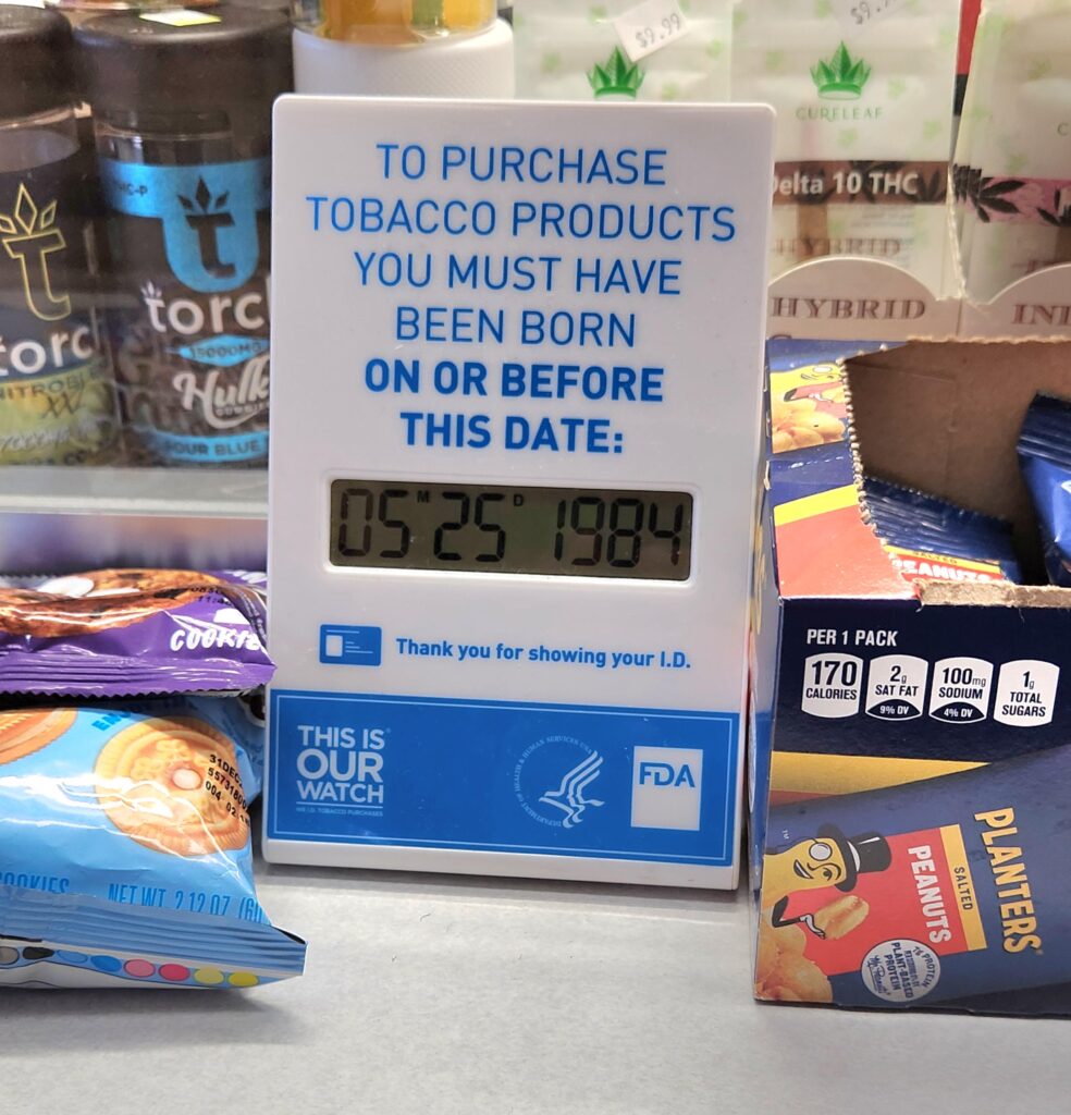 This sign at a convenience store says that you have to be born on or before May 25th, 1984 to purchase tobacco products.
